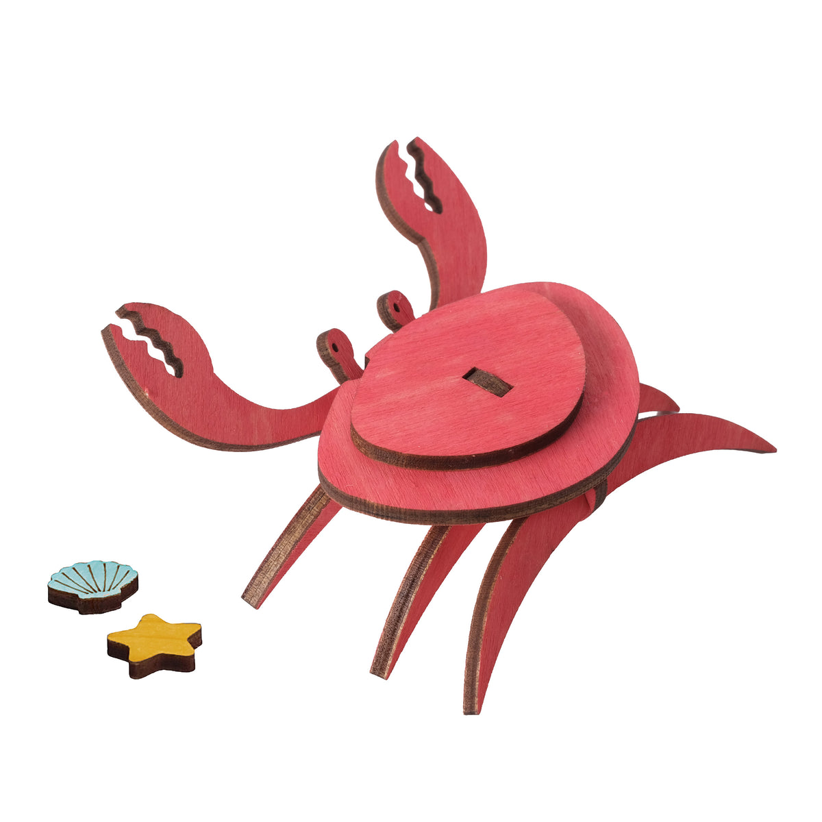 Painted wooden crab with a starfish and a shell, built from the Crab Wooden Craft Kit