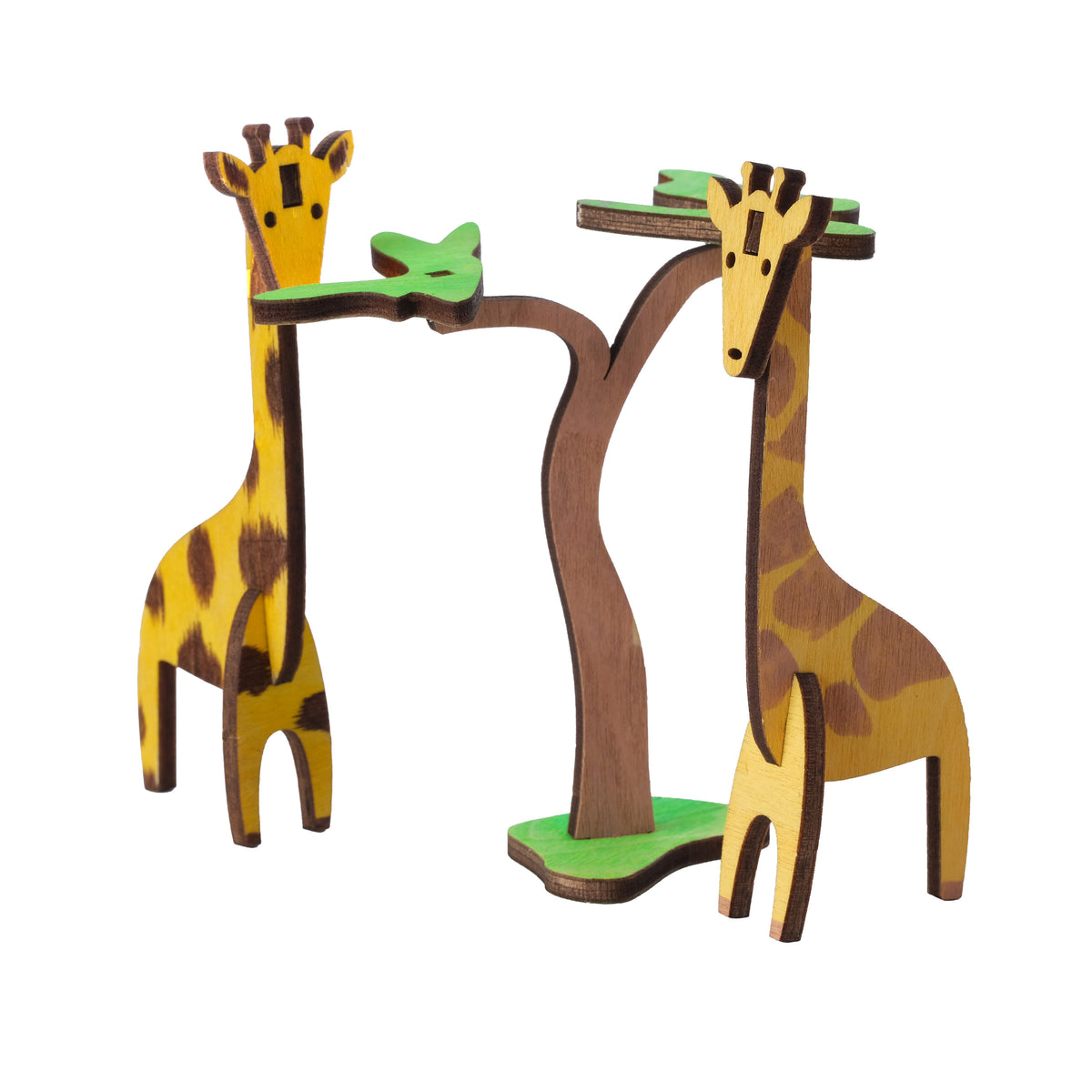 Two painted wooden giraffes beside an acacia tree, built from the Giraffe Wooden Craft Kit
