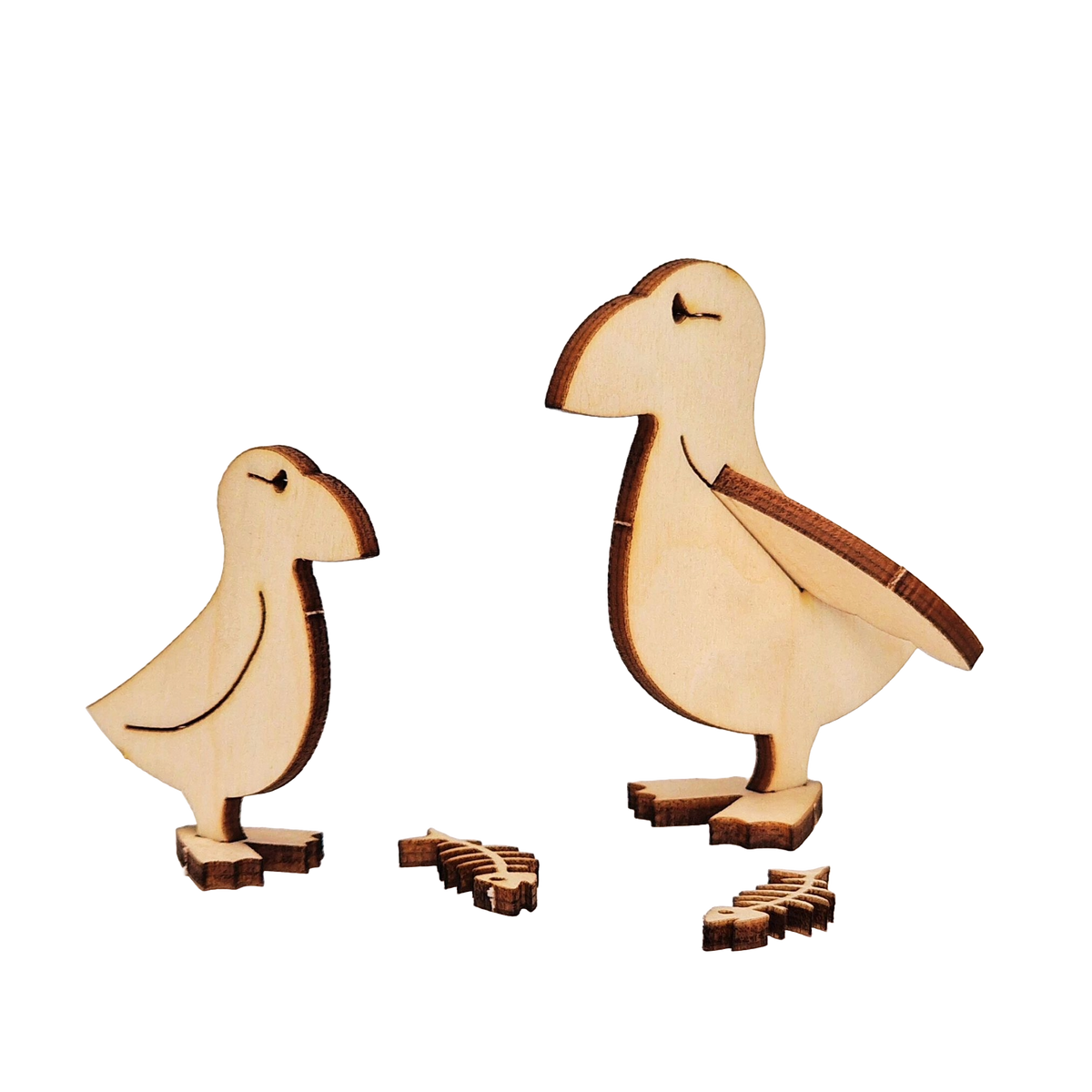 Unpainted birch plywood puffin, puffling and two fish skeletons from the Puffin Wooden Craft Kit