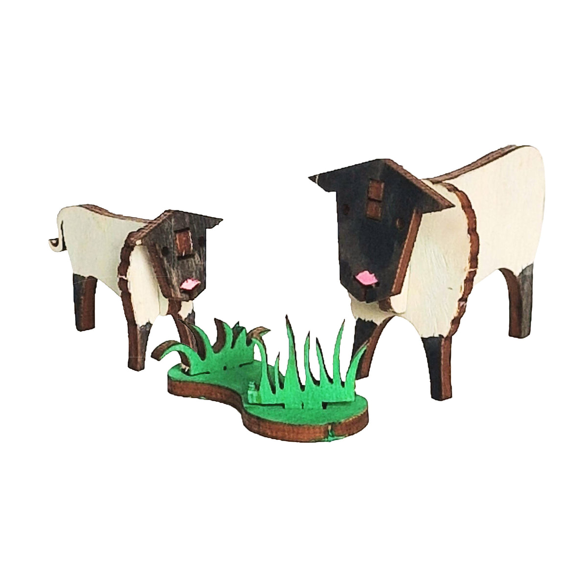 Painted wooden sheep and lamb with a patch of grass, built from the Sheep Wooden Craft Kit